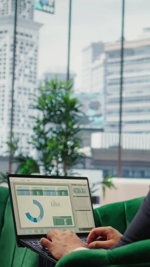 Vertical Video Goal oriented businessman in high end corporate office plans a Stock Footage 317409980