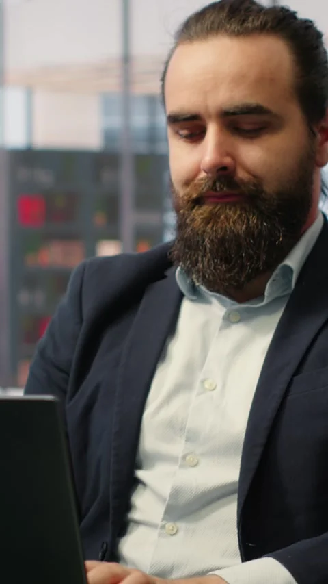 Vertical Video Goal oriented businessman focuses on his company and career Stock Footage 317411493
