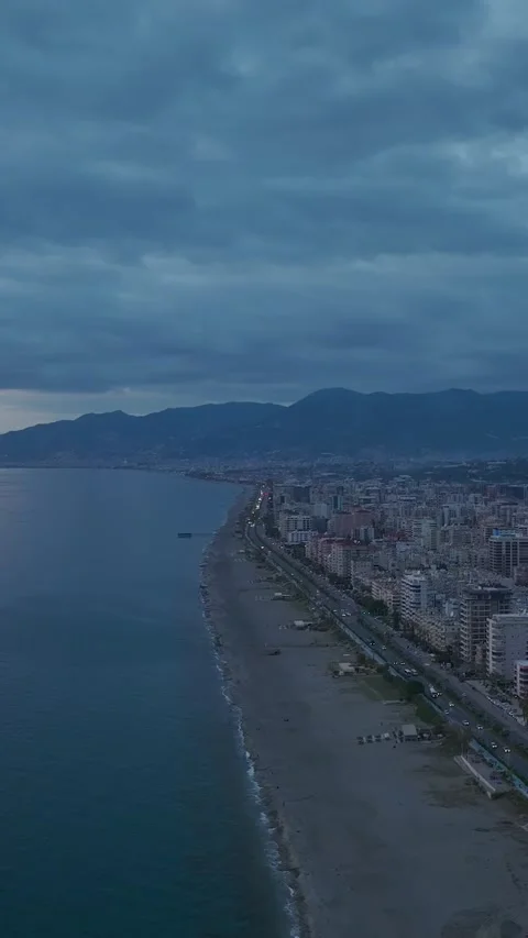 Vertical Video: Golden light breaks through clouds over the Mediterranean Sea Stock Footage 297656838