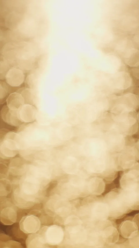 Vertical video. Golden Sunset Reflection Dancing Across Gentle Sea Waves Creatin Video stock 339019001