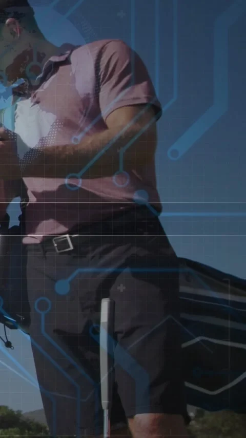 Vertical video: Golfer retrieving device and checking data preparing shot Stock Footage 331790051