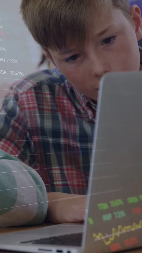 Vertical video: Graphics appearing on laptop, boy leaning in class, studying Stock Footage 333182119