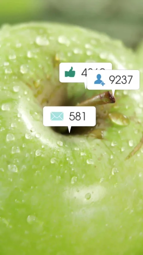 Vertical video: Green apple getting alert bubbles from frame three, showing Stock Footage 333836140