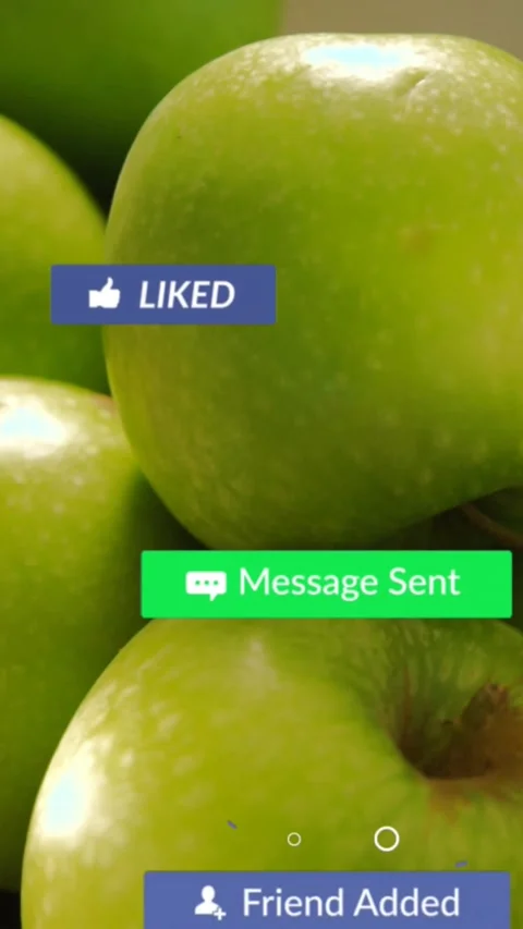 Vertical video: Green apples, mouse clicking Play badge causing social media Stock Footage 332334892