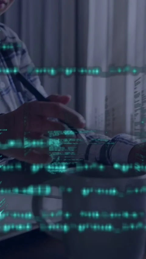 Vertical video: Green code appearing overlaying desk, woman dev typing keys, Stock Footage 335741031