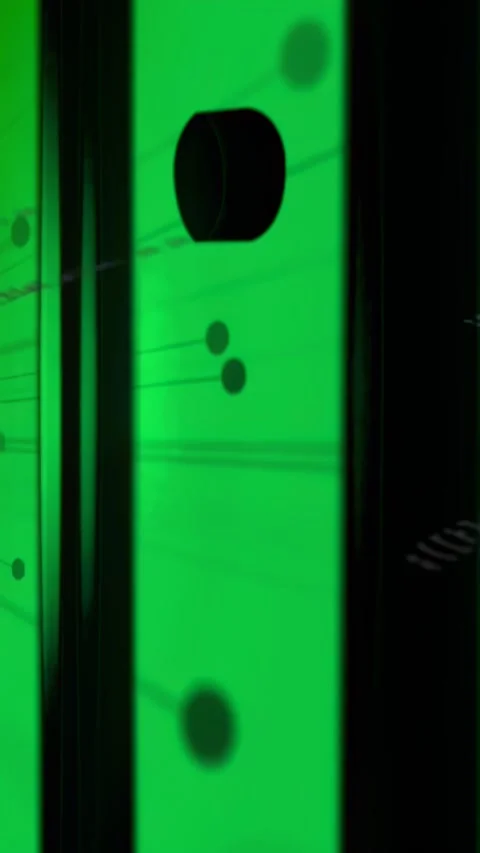 Vertical video: Green panel reacting to particles, showing drifting dots and Stock Footage 334390575