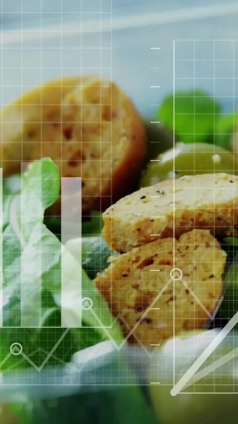 Vertical video: Green salad having data overlay appearing, camera shifting to Stock Footage 334396524