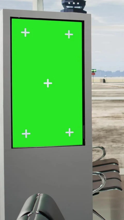 Vertical Video Green screen board in empty airport terminal with runway shown on Stock Footage 344372798