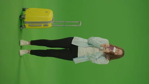 Vertical Video. Green Screen. Chroma Key. Woman in the Hands of With Tickets Stock Footage 220746817