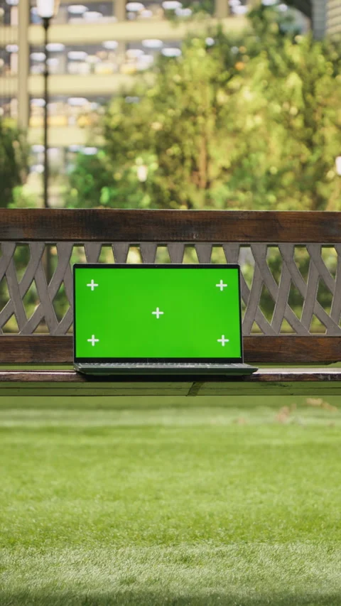Vertical Video Green screen isolated mockup laptop on wooden bench placed in Stock Footage 344376347