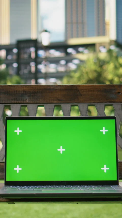 Vertical Video Green screen isolated mockup laptop on wooden bench placed in Stock Footage 344381587
