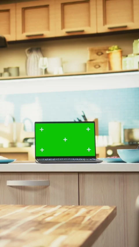 Vertical Video Green screen laptop in empty kitchen with island and modern Stock Footage 320708859