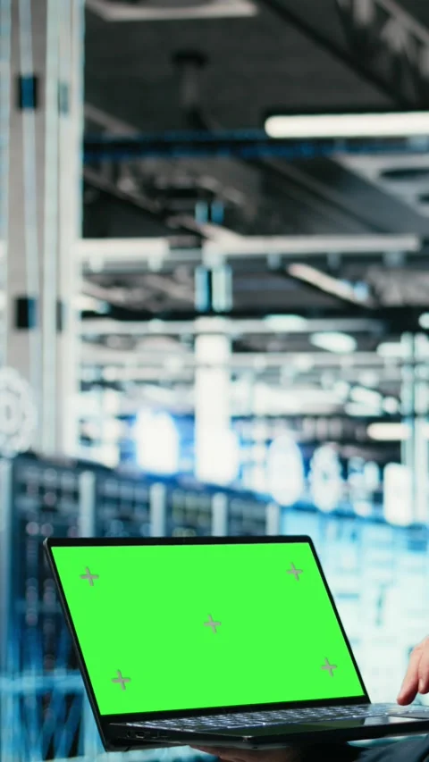 Vertical video Green screen laptop in data center and AR tech used by technician Stock Footage 329451277