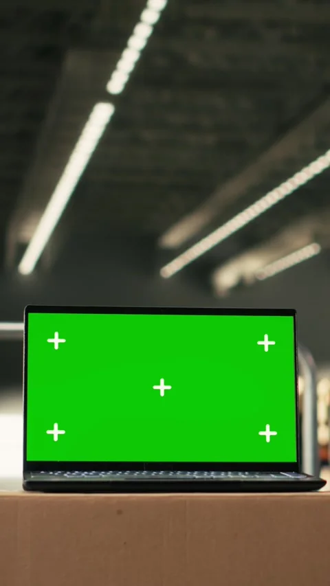 Vertical Video Green screen laptop display in industrial warehouse storage Stock Footage 330375817