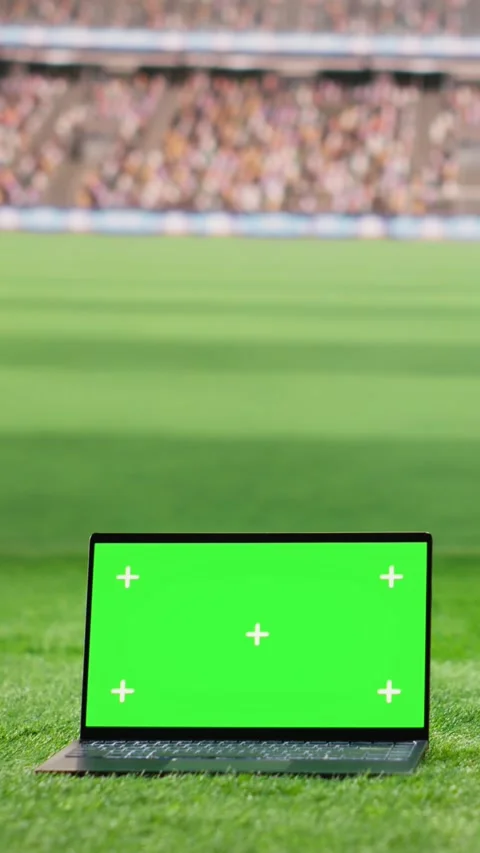 Vertical Video Green screen laptop mockup placed on stadium grass with arena Stock Footage 338047411