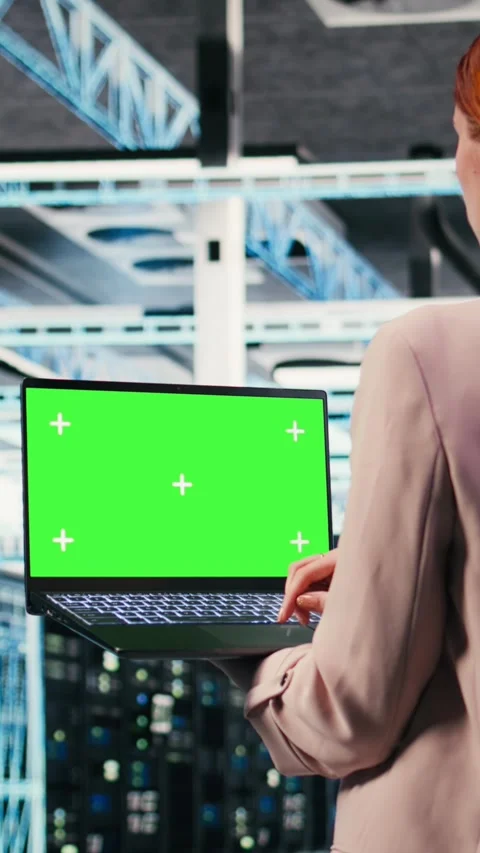 Vertical video Green screen mockup laptop used by server hub worker to do Stock Footage 330201570