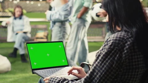Vertical Video Green screen phone mockup held close to camera in outdoor campus Stock Footage 340801339