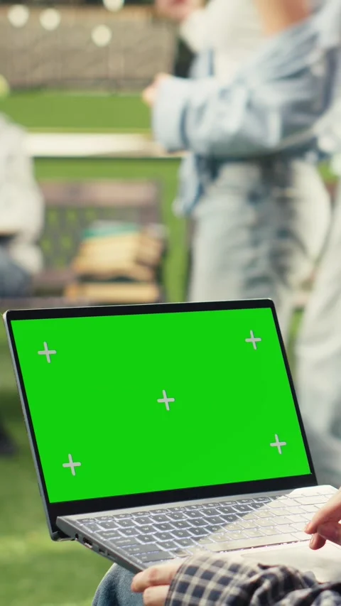 Vertical Video Green screen phone mockup held close to camera in outdoor campus Stock Footage 341316836
