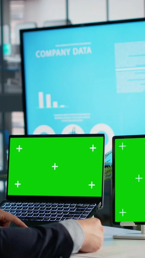 Vertical Video Green screen, tablet and laptop, data analysis on documents Stock Footage 327822710