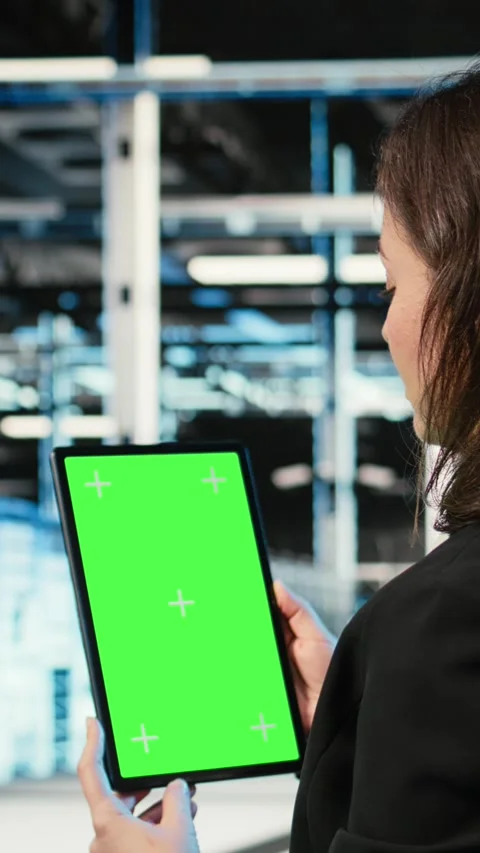 Vertical video Green screen tablet, optimizing servers and admin in data center Stock Footage 329316930