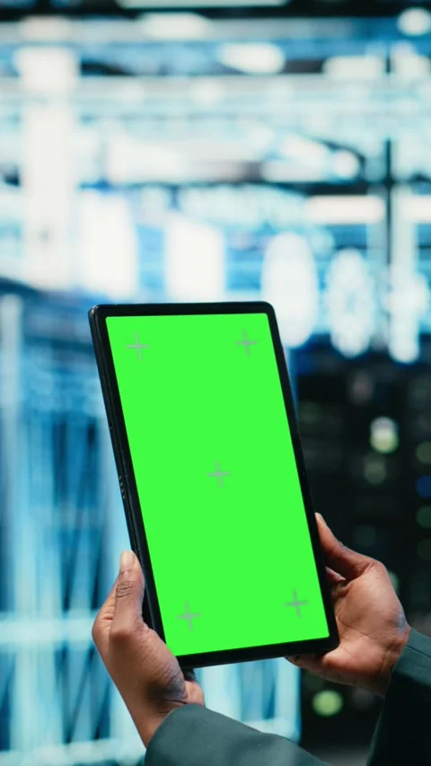 Vertical video Green screen tablet in data center and augmented reality used by Stock Footage 329590856