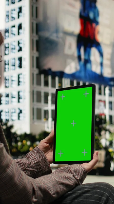 Vertical video Green screen tablet used by businesswoman on park bench Stock Footage 343559509