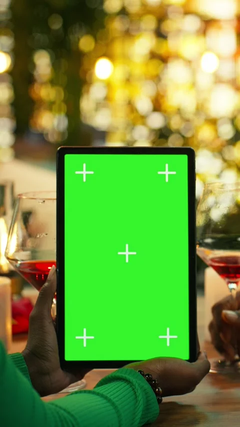 Vertical video Green screen tablet used by couple bonding at rooftop restaurant Stock Footage 347086080
