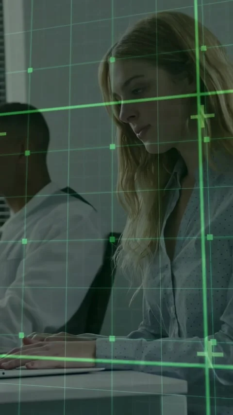 Vertical video: Grid appearing, typing woman in button blouse editing report on Video stock 331168981
