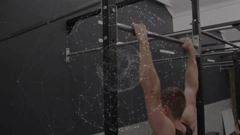 Vertical video: Gripping rack pullup bar, man in black top pulling for strength Stock Footage 330713522