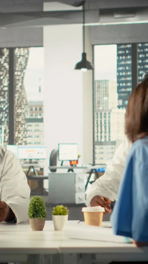Vertical Video Group of diverse colleagues consulting on a master plan for urban Stock Footage 321780721