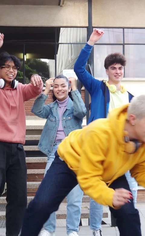 Vertical video. Group of diverse young people dancing hip hop on the street Stock Footage 221028104