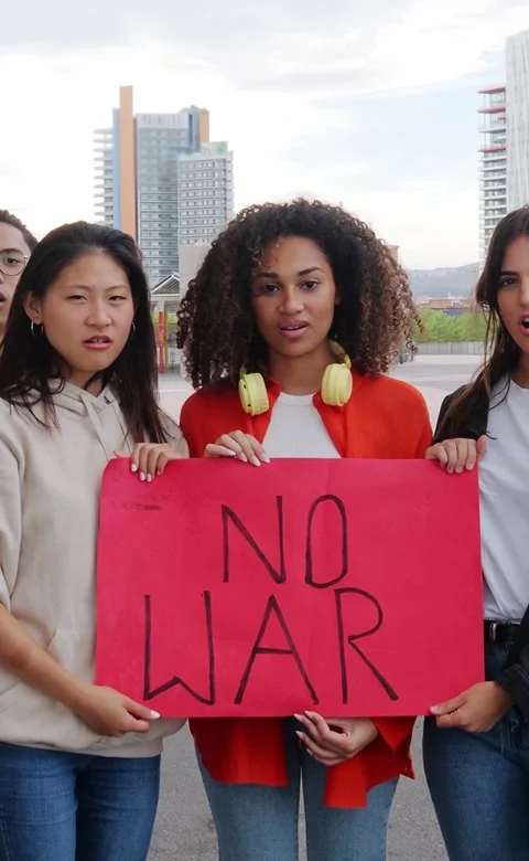 Vertical video. Group of diverse young people protesting against the war Stock Footage 245837307
