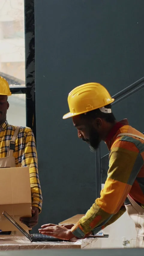Vertical video: Group of workers checking quality of supplies Stock Footage 231978250