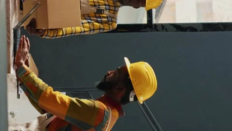 Vertical video: Group of workers checking quality of supplies Stock Footage 232638000