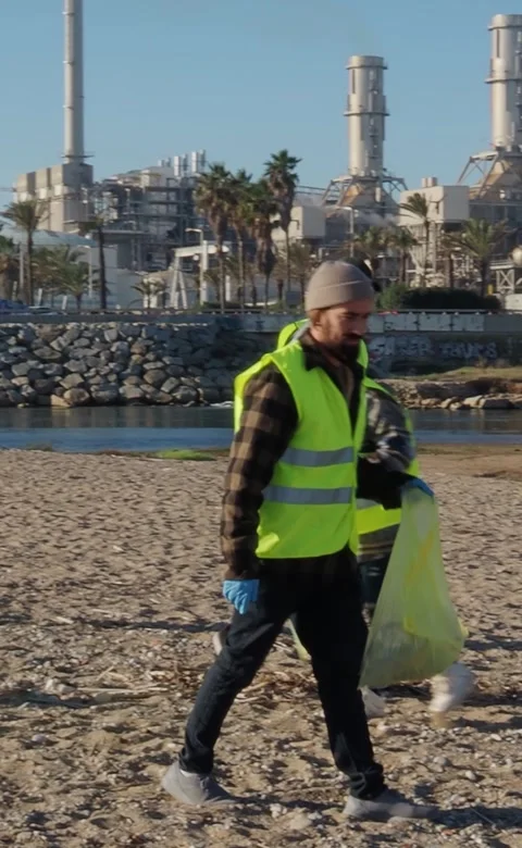 Vertical video of Group of young ecologist volunteers collecting garbage Stock Footage 263157333