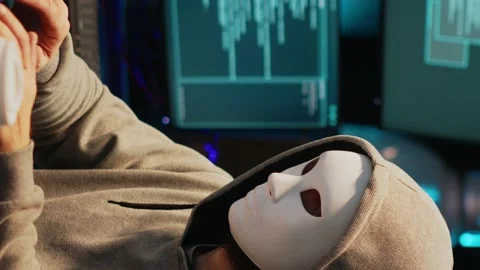 Vertical video: Hacker with anonymous mask breaking security system Stock Footage 221654950