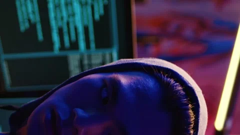 Vertical video Hacker paranoid while developing spyware Stock Footage 255331358