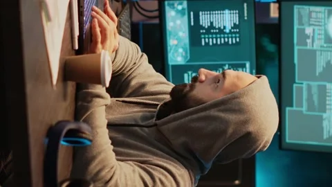 Vertical video: Hacker programmer coding system late at night Stock Footage 222213063