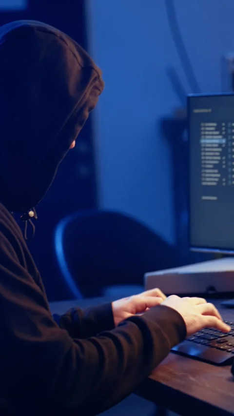 Vertical video Hacker using computer to target vulnerable unpatched connections Stock Footage 319519627
