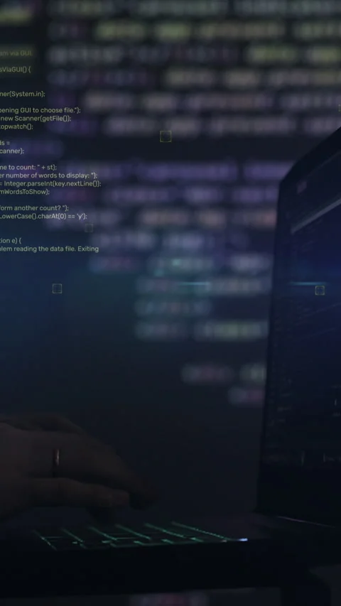 Vertical video. Hacker writing code cracking computer. Programming code in the Stock Footage 347148456