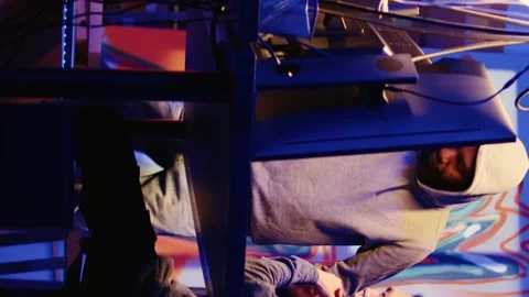 Vertical video Hackers coding malware together Stock Footage 255331804