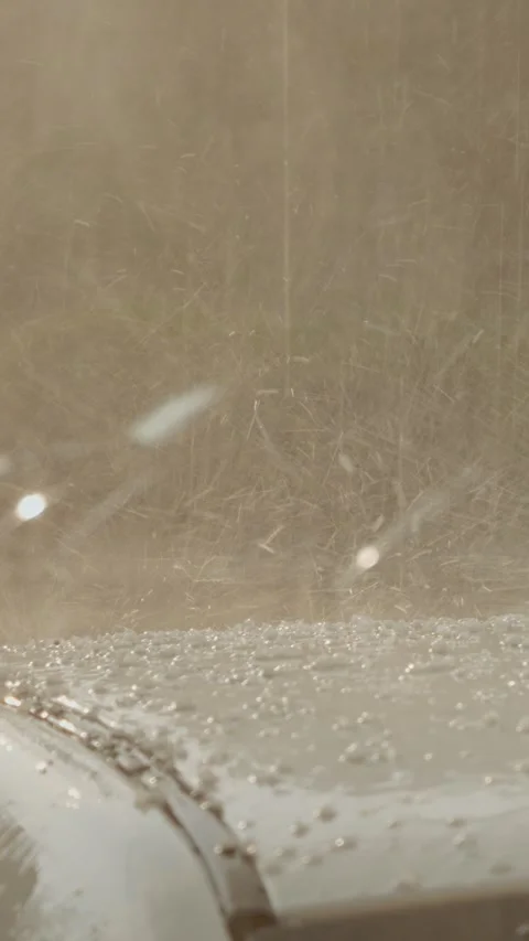 Vertical video Hailstones bouncing on car roof during heavy rain Stock Footage 306228078