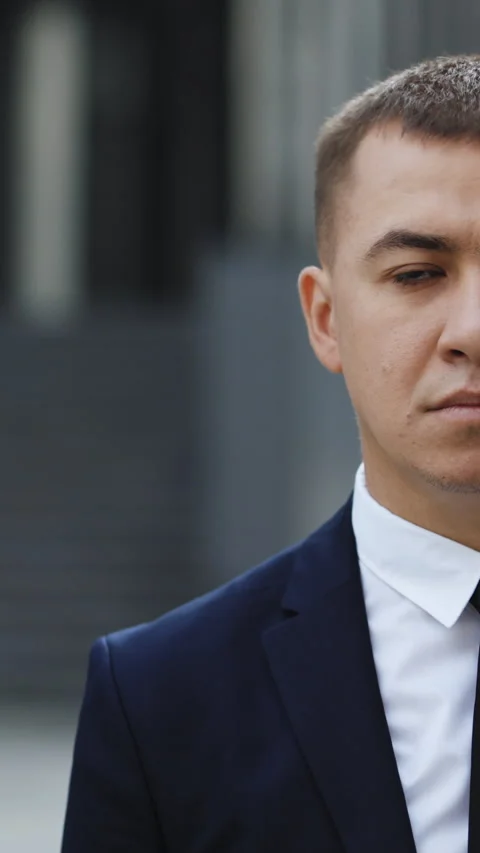 Vertical Video of half face portrait of caucasian handsome professional young Stock Footage 302804625