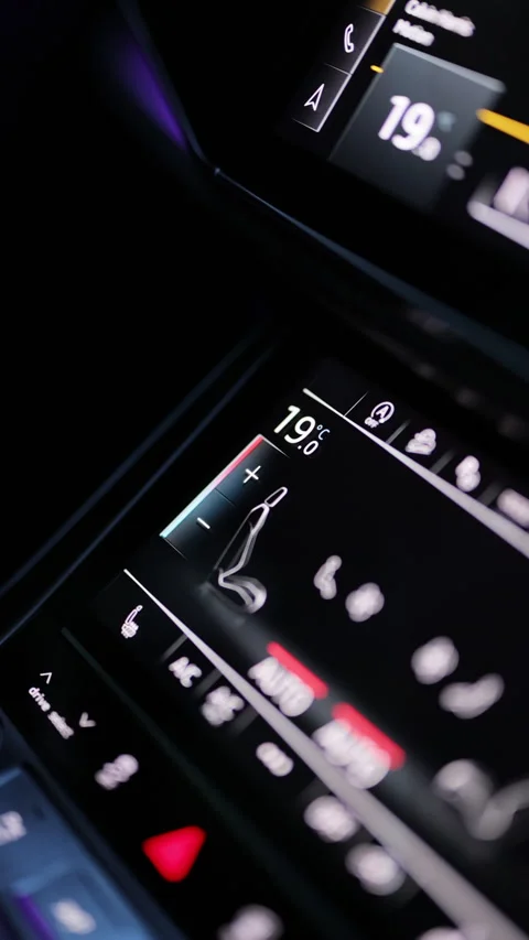 Vertical video of a hand adjusts the climate control system in a car. Male hand Stock Footage 335948494