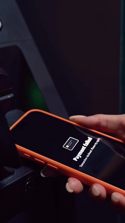 Vertical video. Hand Bringing Smartphone to ATM While Payment Failure Icon Shows Stock Footage 323464872
