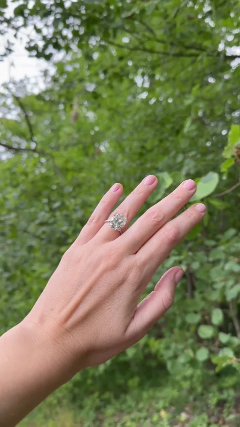 Vertical video hand with engagement ring and platinum band in woods Video stock 317337540