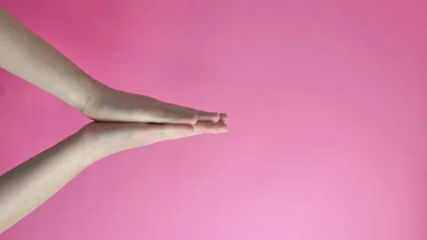 Vertical video. hand gestures. request. Isolated on pink background. Advertising Stock Footage 151685710