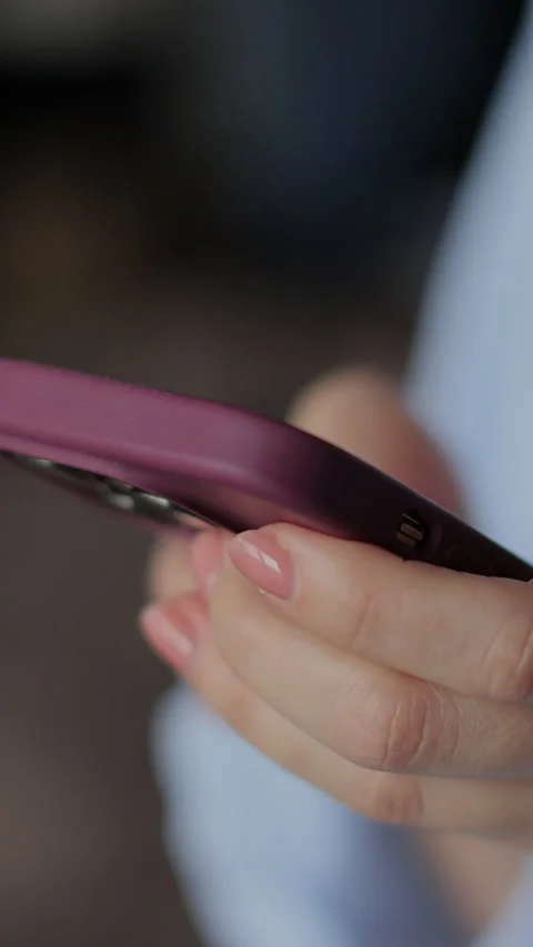 Vertical video Hand of girl using smartphone in the living room at home Stock-Footage 337650965