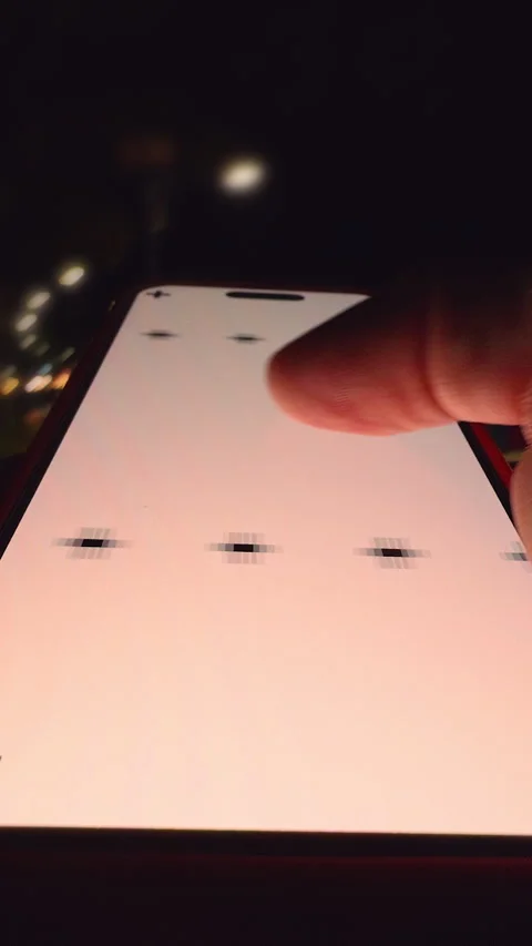 Vertical video. Hand Holding Smartphone with Tracking Marks While Swiping Stock Footage 320723009
