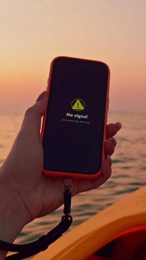 Vertical video. Hand Holding Smartphone Showing No Signal Message While Sitting Stock Footage 329641117